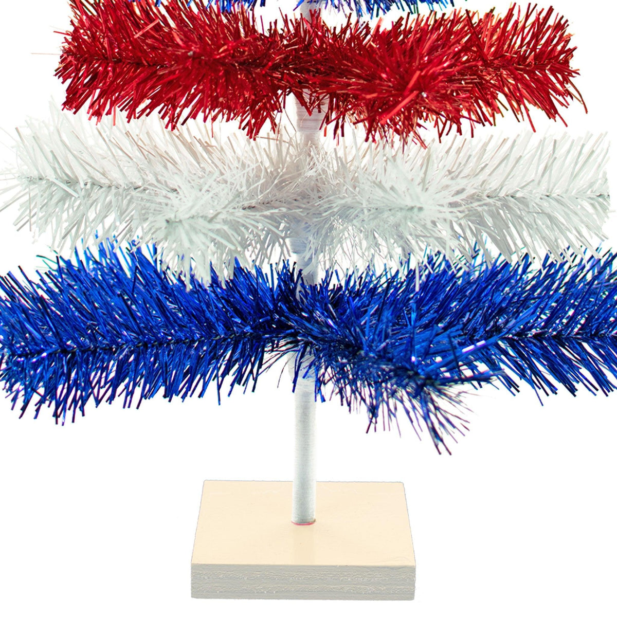 18in tall Red, White, and Blue Layered Tinsel Christmas Trees made by hand in the USA.  Decorate for the holidays with retro 4th of July-themed Trees and start creating your centerpiece now.  Shop for more at leedisplay.com