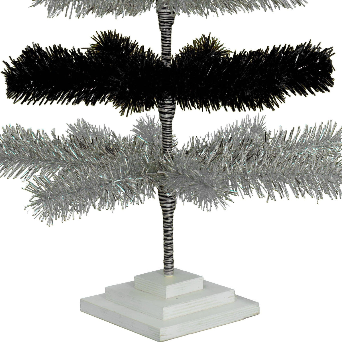 Black & Silver Layered Tinsel Christmas Trees! Decorate for the holidays with a Shiny Black and Metallic Silver retro-style Christmas Tree. On sale now at leedisplay.com