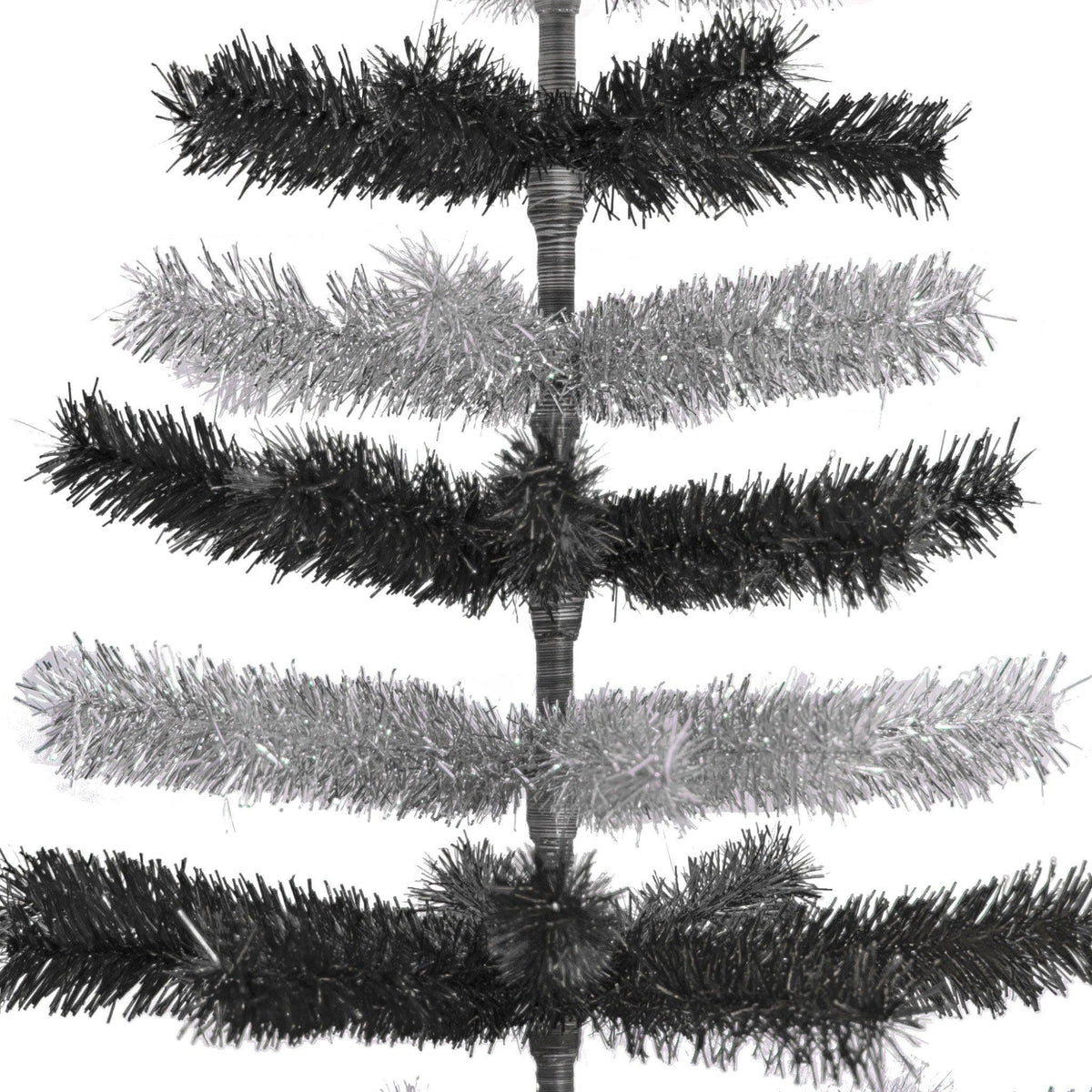 Black & Silver Layered Tinsel Christmas Trees!    Decorate for the holidays with a Shiny Black and Metallic Silver retro-style Christmas Tree.  On sale now at leedisplay.com