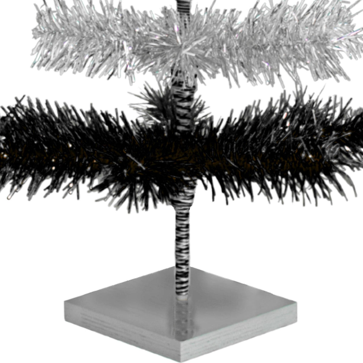 Black & Silver Layered Tinsel Christmas Trees!    Decorate for the holidays with a Shiny Black and Metallic Silver retro-style Christmas Tree.  On sale now at leedisplay.com