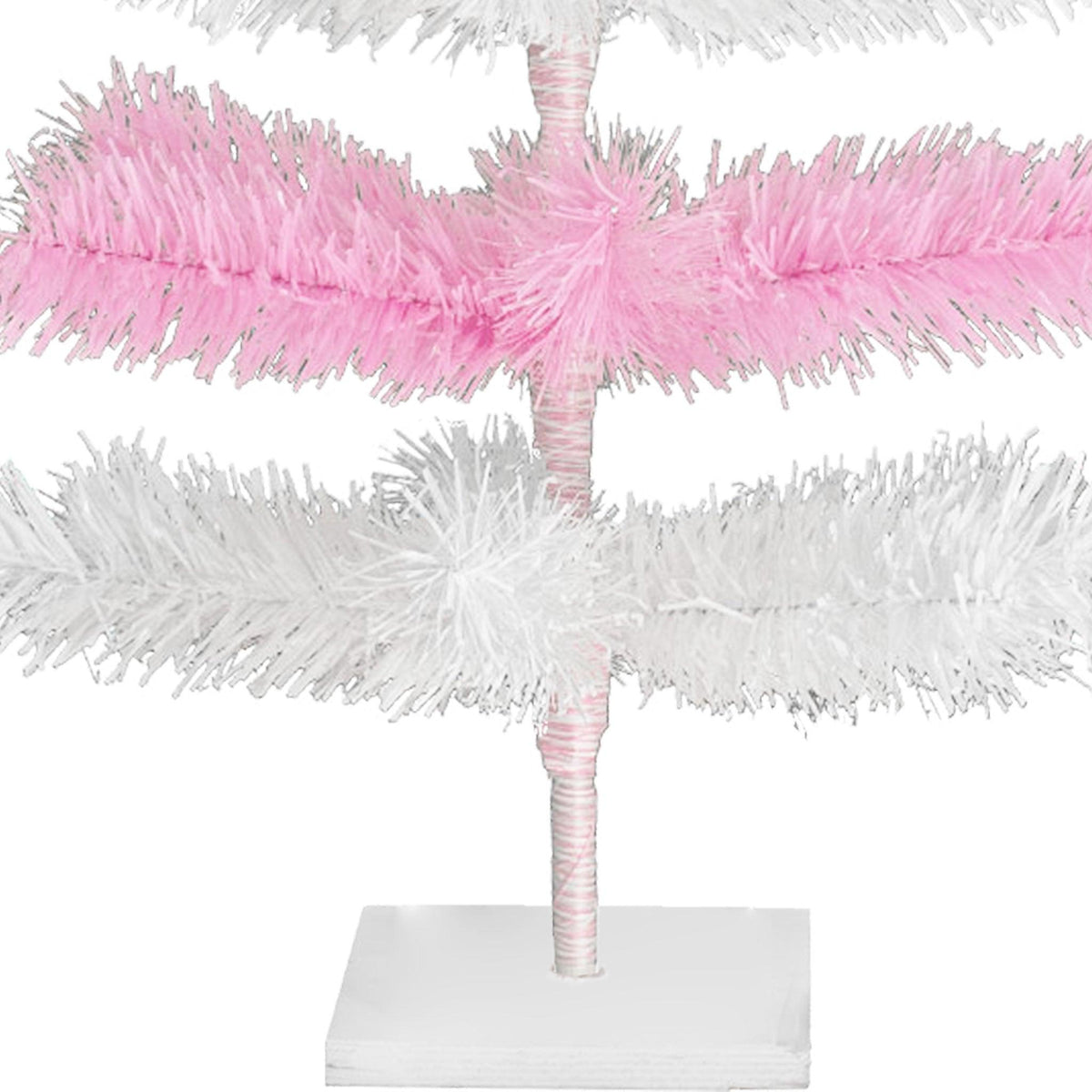 Pink & White Layered Tinsel Christmas Trees! Decorate for the holidays with a Shiny Pink and Matte White retro-style Christmas Tree. Incorporate a little purple and white into your holiday decorations this year. On sale at leedisplay.com