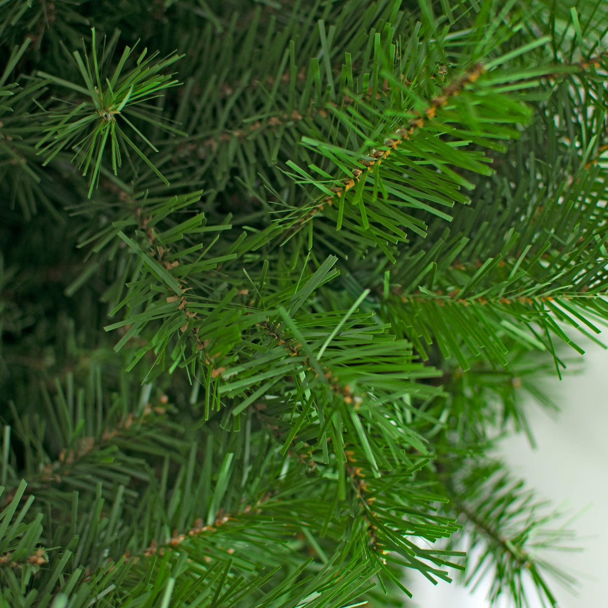 Close of the green pine tips with brown stems. 10FT Premier Pine Tree Pre-Lit with LED Lights.  On sale from leedisplay.com