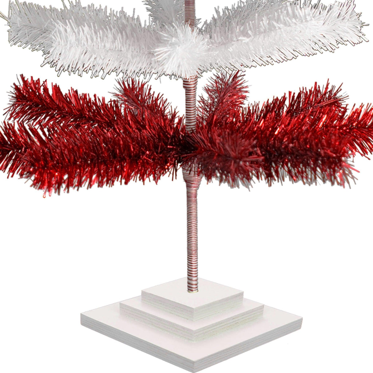 Red & White Layered Tinsel Christmas Trees!    Decorate for the holidays with a Shiny Red and Matte White retro-style Christmas Tree.  Incorporate a little white and blue into your holiday decorations this year.  Shop now at leedisplay.com