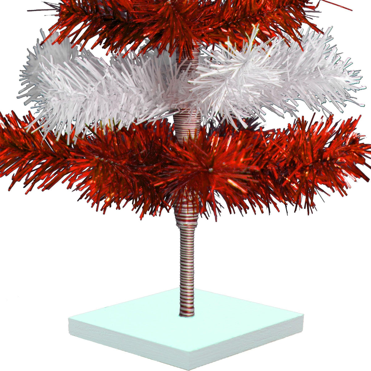 Red & White Layered Tinsel Christmas Trees!    Decorate for the holidays with a Shiny Red and Matte White retro-style Christmas Tree.  Incorporate a little white and blue into your holiday decorations this year.  Shop now at leedisplay.com