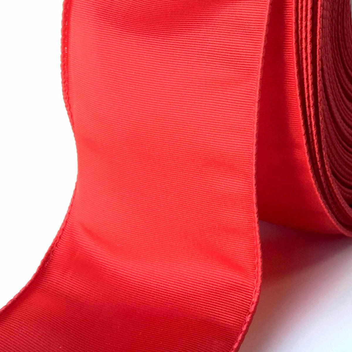 Lee Display's roll of Red Bengaline Christmas Ribbon with a Wired-Edge on sale at leedisplay.com