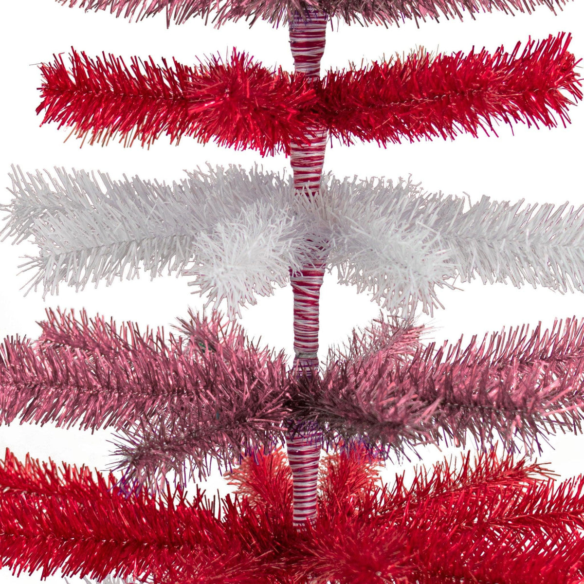 Red, White, and Pink Layered Tinsel Christmas Trees made by hand in the USA     Decorate for the holidays with retro Valentine's Day-themed Trees and start creating your centerpiece.  Shop now at leedisplay.com