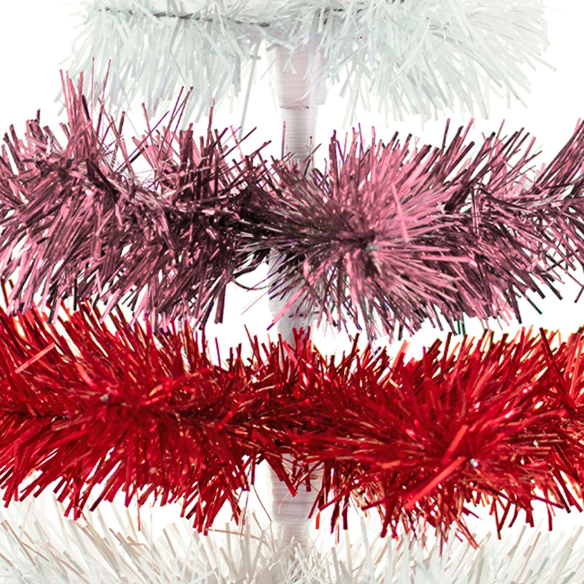 Red, White, and Pink Layered Tinsel Christmas Trees made by hand in the USA     Decorate for the holidays with retro Valentine's Day-themed Trees and start creating your centerpiece.  Shop now at leedisplay.com