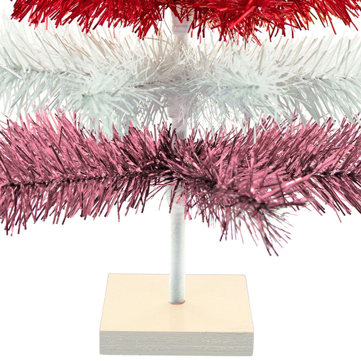 Red, White, and Pink Layered Tinsel Christmas Trees made by hand in the USA     Decorate for the holidays with retro Valentine's Day-themed Trees and start creating your centerpiece.  Shop now at leedisplay.com